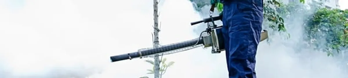 Pest control technician fogging an outdoor area for insect control in Sterling Heights, MI